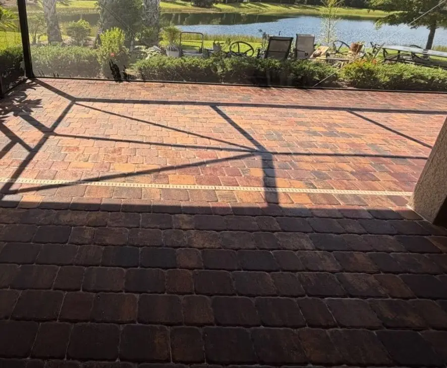 A paver lanai beside a lake in Del Webb, Lakewood Ranch, after