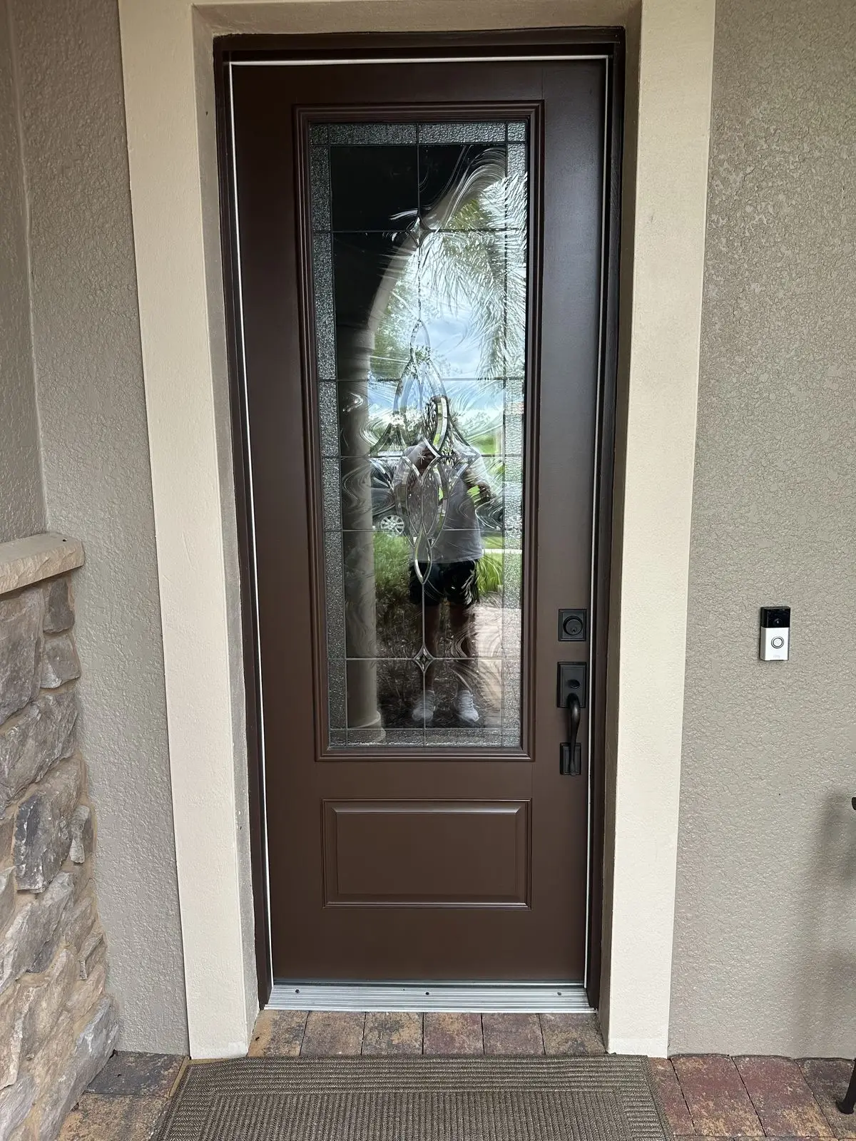 The finished front door, an even brown around its leaded glass panel