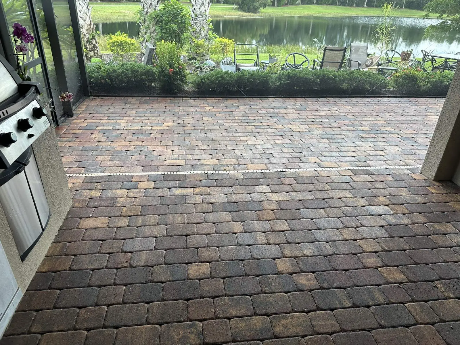 The cleaned lanai looking out through the screen to the lake