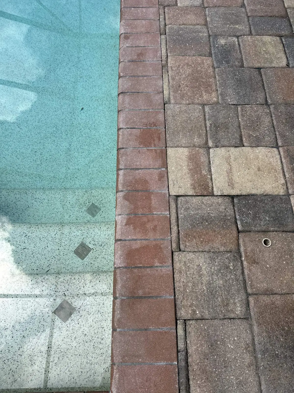 Pool coping pavers with hazy, blotchy old sealer