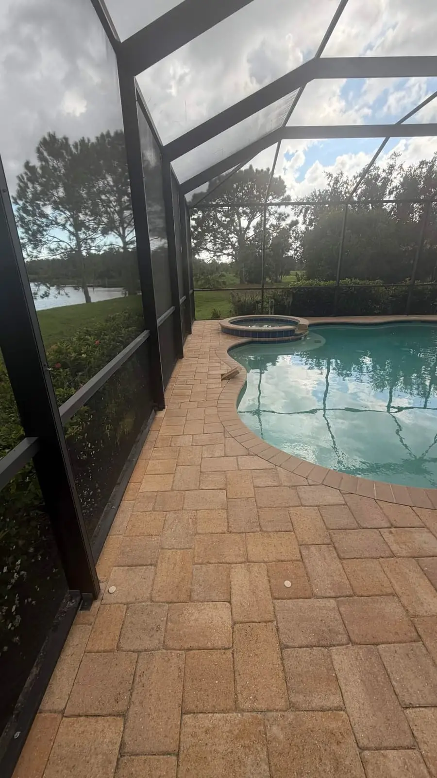 The pool deck cleaned up, looking out toward the lake